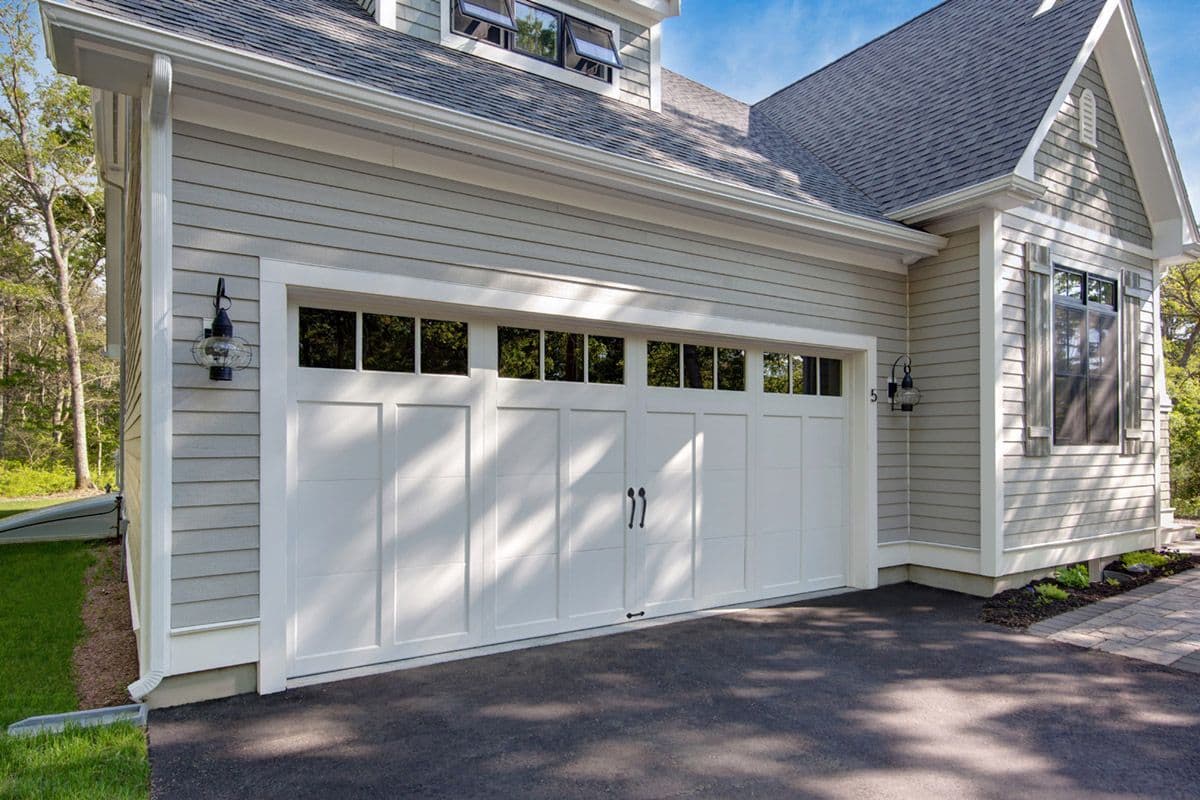 White carriage house garage door on sunny day