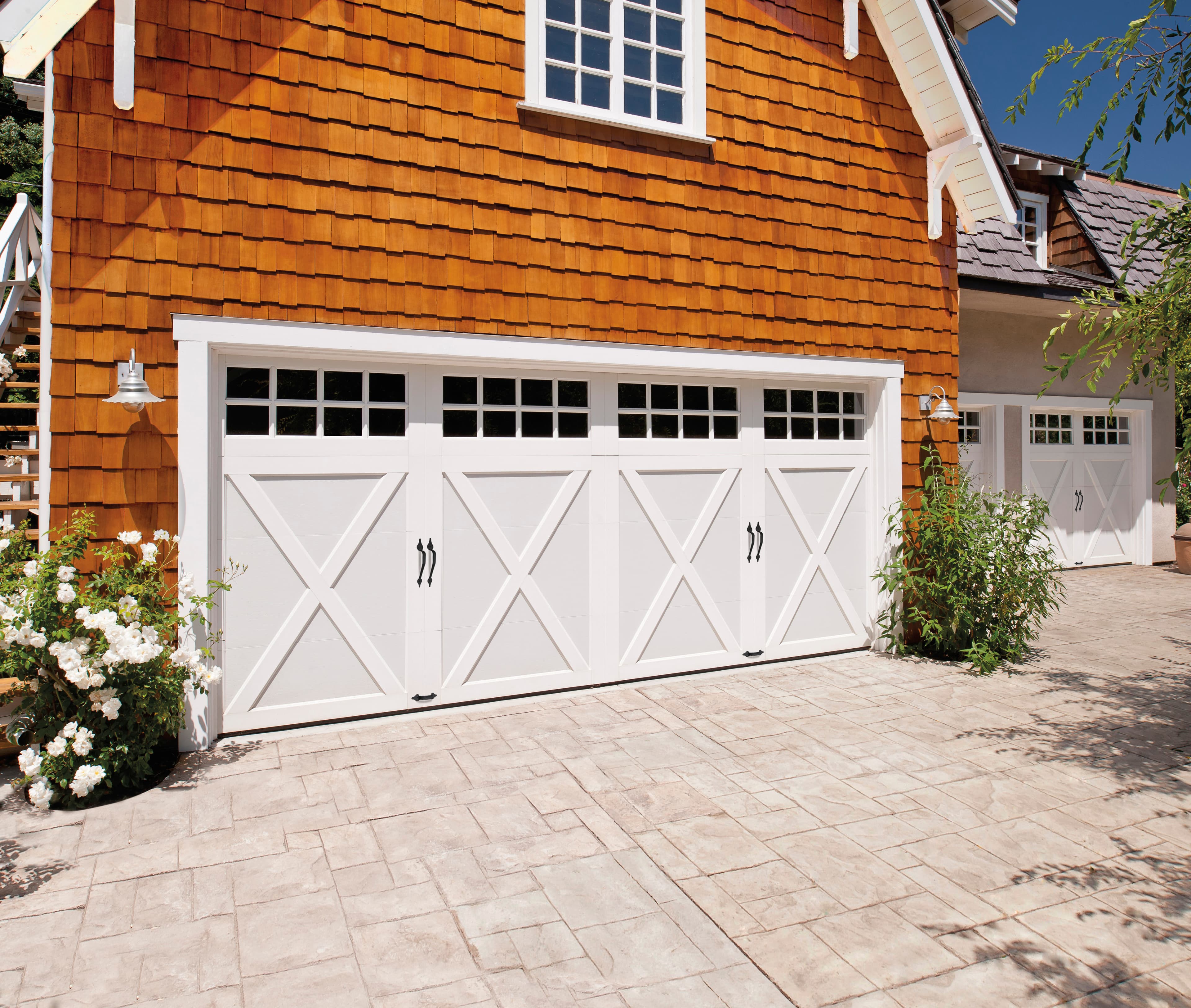 Coachman carriage house style garage door — professional installation by Top-Notch Garage Doors